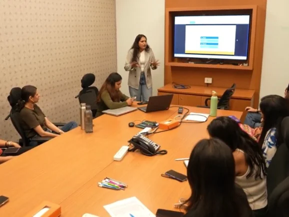 Trijog facilitator presenting to employees in a meeting room