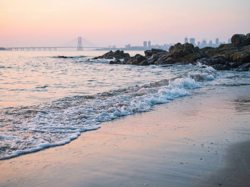 Gentle waves on an empty Mumbai shore at dawn